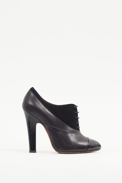 Alaïa Black Leather 
Suede Lace Up Bootie