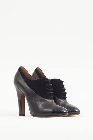 Alaïa Black Leather 
Suede Lace Up Bootie