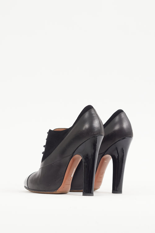 Alaïa Black Leather 
Suede Lace Up Bootie