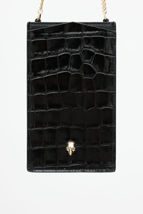 Alexander McQueen Black 
Gold Embossed Skull Phone Case