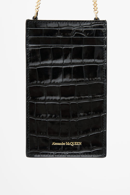 Alexander McQueen Black 
Gold Embossed Skull Phone Case