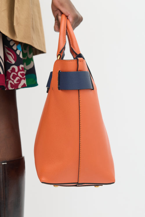 Burberry Orange 
Navy Leather Medium Belt Tote Bag