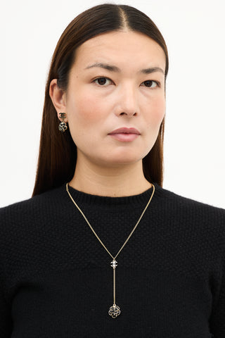 Chanel SS 2009 Gold 
Black Camelia CC Drop Necklace