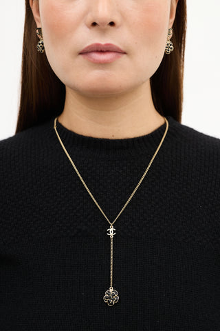 Chanel SS 2009 Gold 
Black Camelia CC Drop Necklace