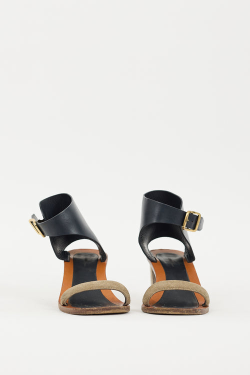 Celine Brown 
Black Buckle Heel