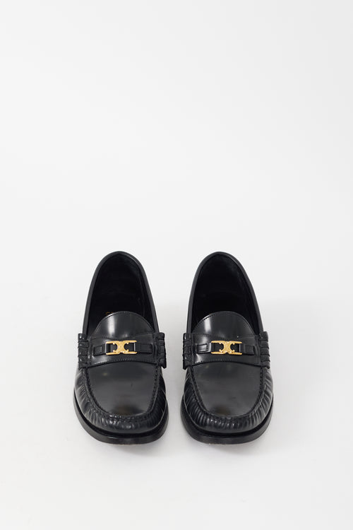 Celine Black 
Gold Leather Luco Triomphe Loafer