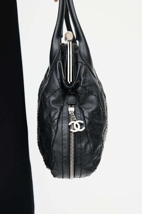 Chanel 2006 Black 
Silver Expandable Zip Around Leather Bag