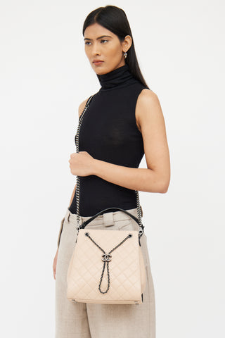 Chanel Beige 
Black Caviar Quilted Bucket Bag