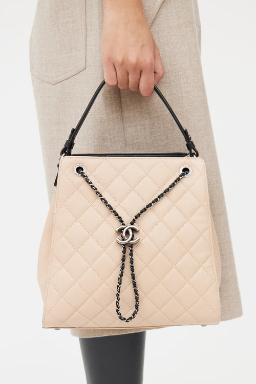 Chanel Beige 
Black Caviar Quilted Bucket Bag