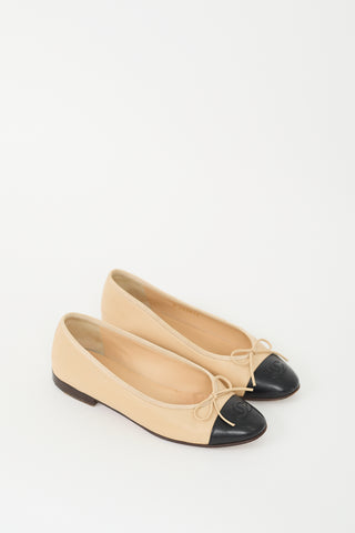 Chanel Beige 
Black Bow Ballet Flat