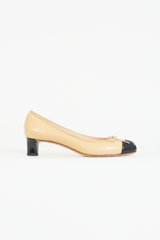 Chanel Beige 
Black Patent Bow Heel