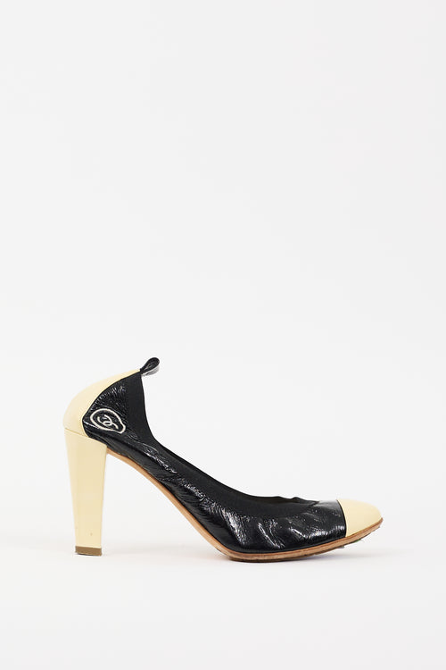 Chanel Black 
Cream Patent Leather CC Pump