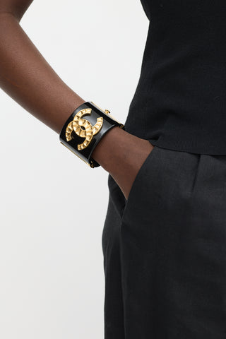 Chanel Black 
Gold Resin CC Wide Cuff Bracelet