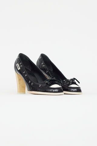 Chanel Black 
White Patent Leather Boat Shoe Pump