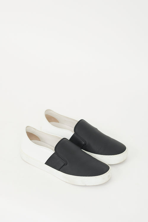 Chanel Black 
White Leather Slip On Sneaker