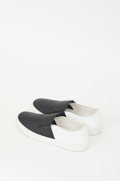 Chanel Black 
White Leather Slip On Sneaker