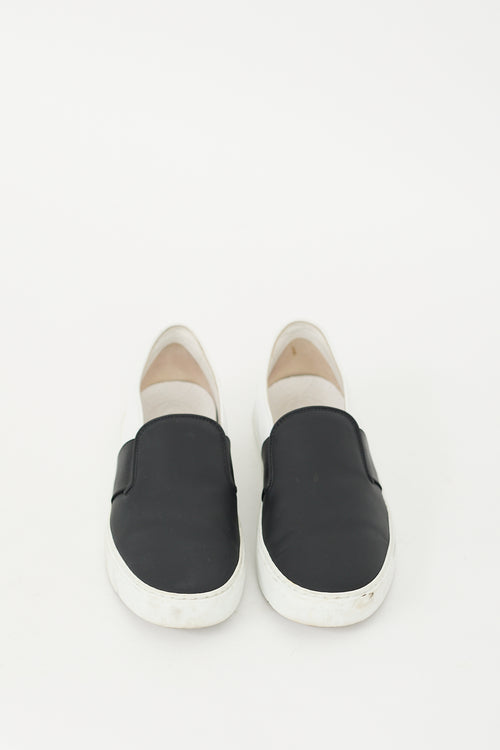 Chanel Black 
White Leather Slip On Sneaker