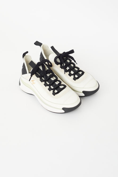 Chanel Cream 
Black Logo Sneaker