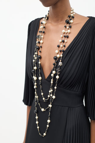 Chanel Cruise 2010 Black 
Cream Pearl Paris-Venice Charms Necklace