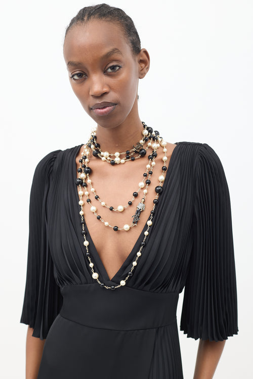 Chanel Cruise 2010 Black 
Cream Pearl Paris-Venice Charms Necklace