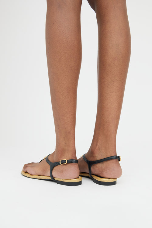 Chanel Gold 
Black Leather T-Strap Logo Sandal