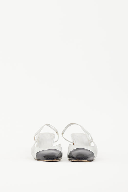 Chanel Silver Leather 
Black CC Slingback Pump