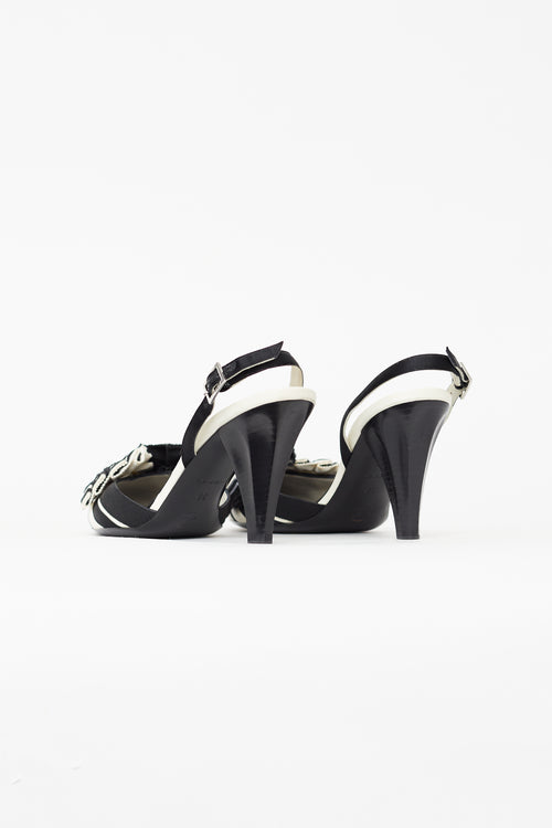 Chanel Vintage Black 
White Canvas Camellia Heel