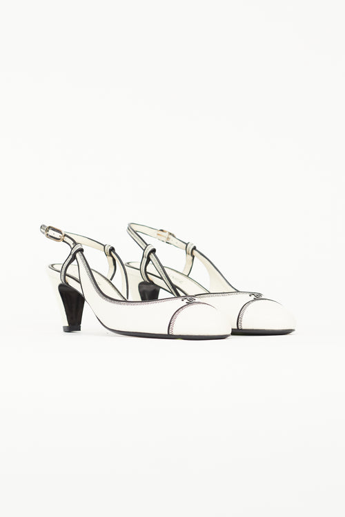 Chanel White 
Black Slingback Heel