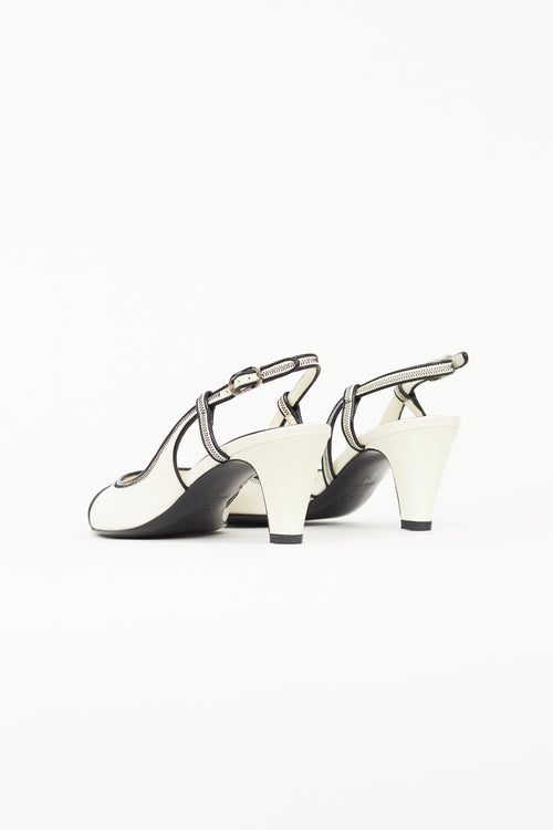 Chanel White 
Black Slingback Heel