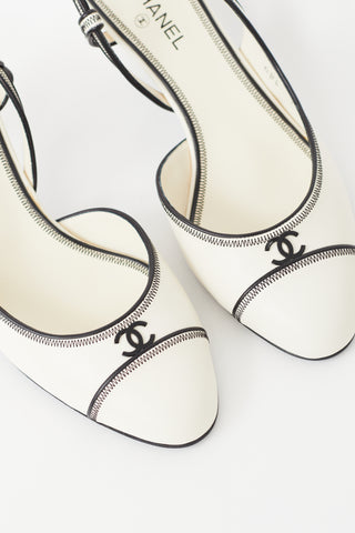 Chanel White 
Black Slingback Heel