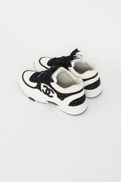 Chanel Black 
White CC Embossed Logo Sneaker