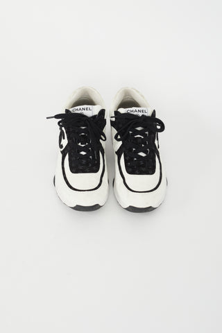 Chanel Black 
White CC Embossed Logo Sneaker