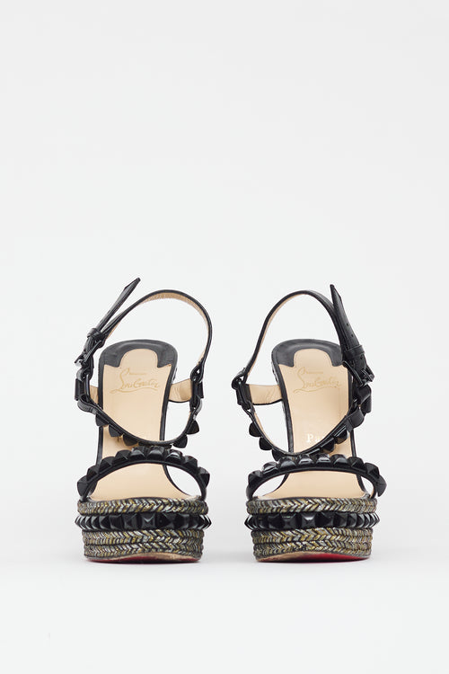 Christian Louboutin Black 
Gold Cataclou Studded Metallic Wedge Sandal