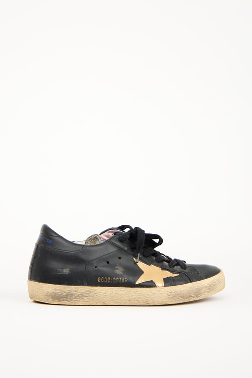 Golden Goose Black 
Gold Leather Superstar Sneaker