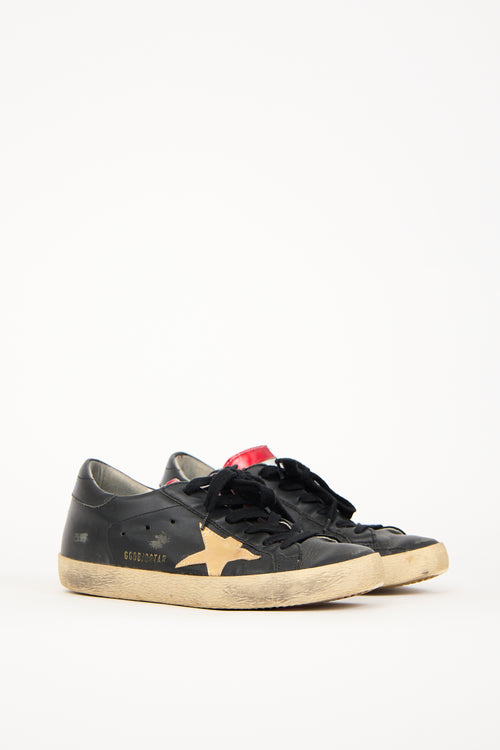 Golden Goose Black 
Gold Leather Superstar Sneaker