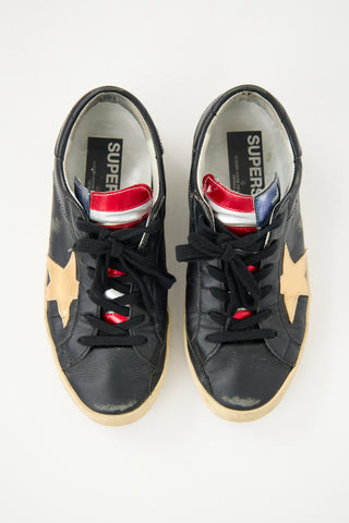 Golden Goose Black 
Gold Leather Superstar Sneaker