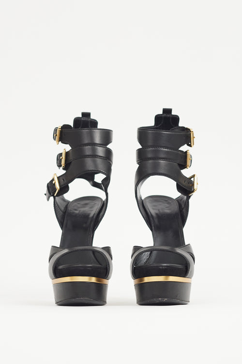 Gucci Black 
Gold Leather Platform Sandal