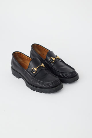 Gucci Black Leather 
Gold Hardware Lug Loafer