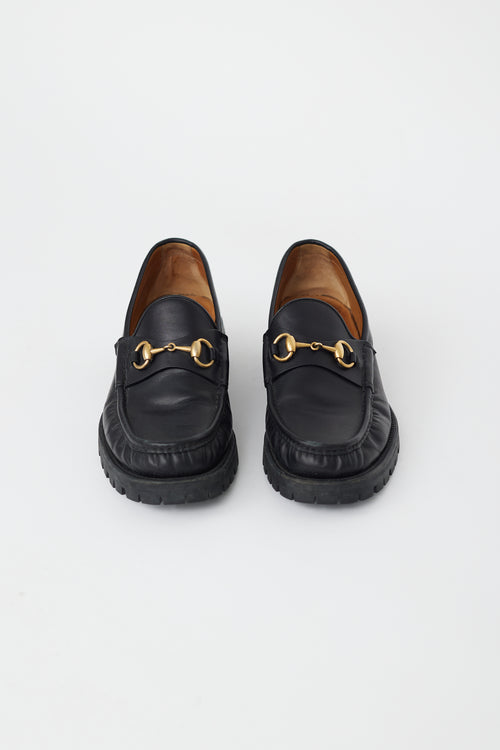 Gucci Black Leather 
Gold Hardware Lug Loafer