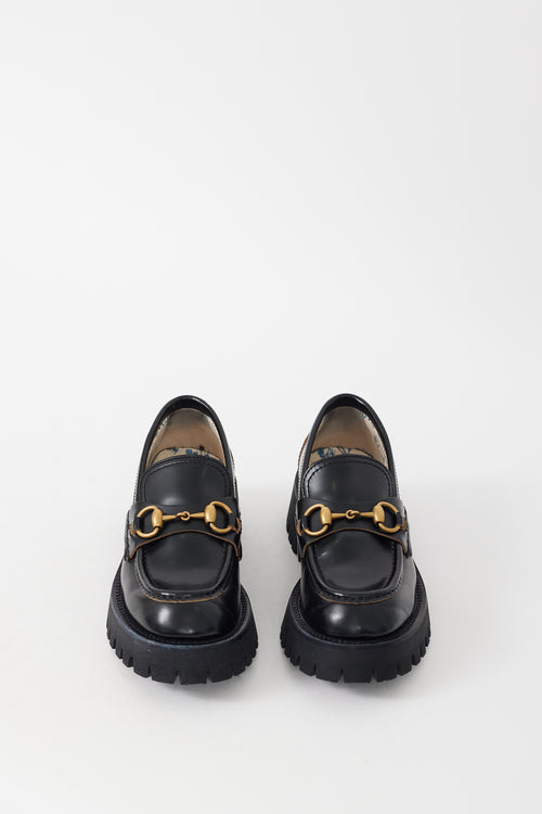 Gucci Black 
Gold Leather Embroidered Lug Sole Loafer