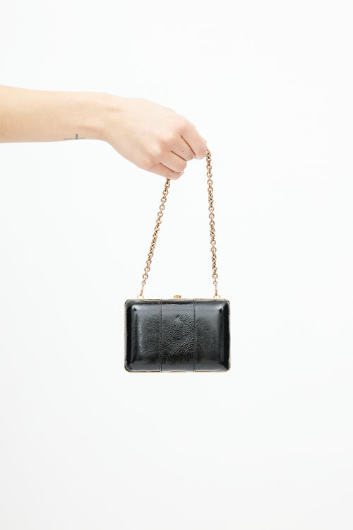 Gucci Black 
Gold Leather Clutch