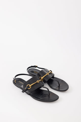 Gucci Black Leather 
Gold Hardware T-Strap Sandal