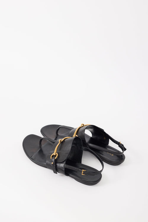 Gucci Black Leather 
Gold Hardware T-Strap Sandal