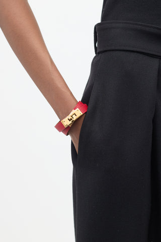 Hermès 2012 Red 
Yellow Gold Leather Kelly Double Tour Bracelet