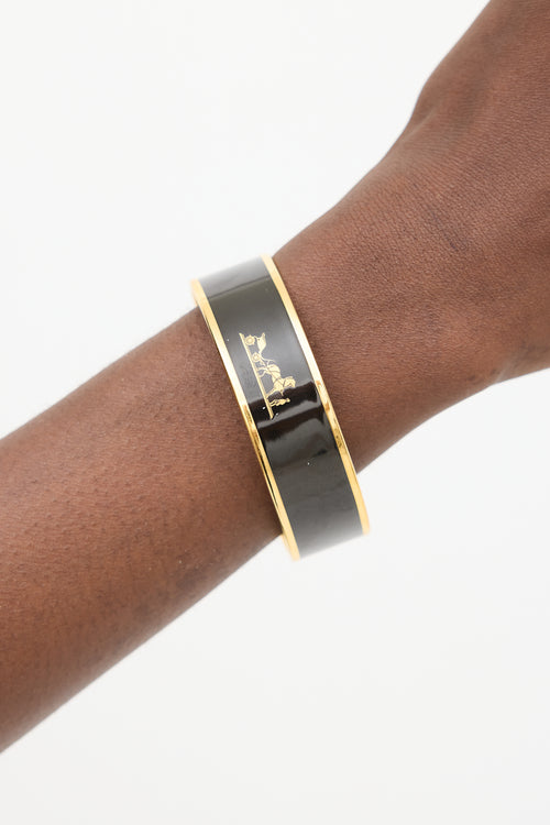 Hermès Black 
Gold Caleche Logo Bangle