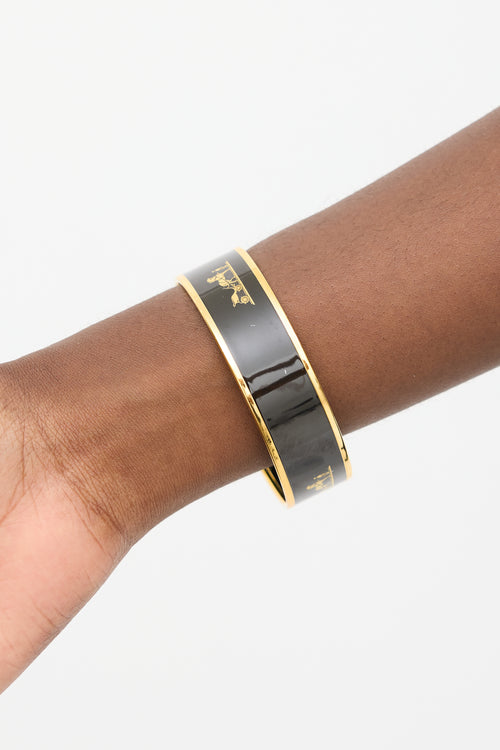 Hermès Black 
Gold Caleche Logo Bangle