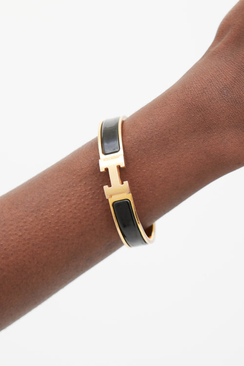 Hermès Black 
Gold Clic H Bracelet