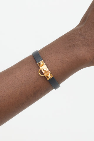 Hermès Black 
Yellow Gold Leather Rivale Bracelet