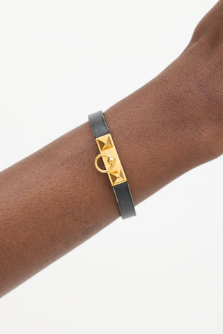 Hermès Black 
Gold Leather Rivale Bracelet