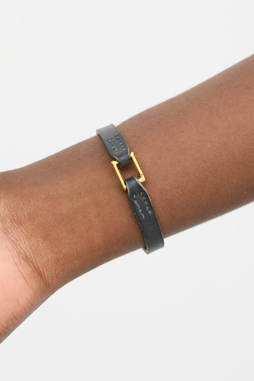 Hermès Black 
Gold Leather Rivale Bracelet